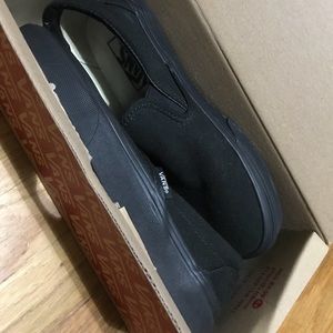 Vans all black slip ons